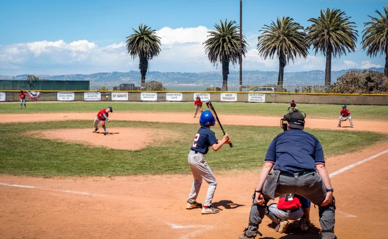 Children playing baseball at a sport camp