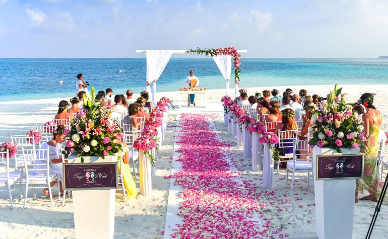Beach wedding ceremony covered by wedding insurance
