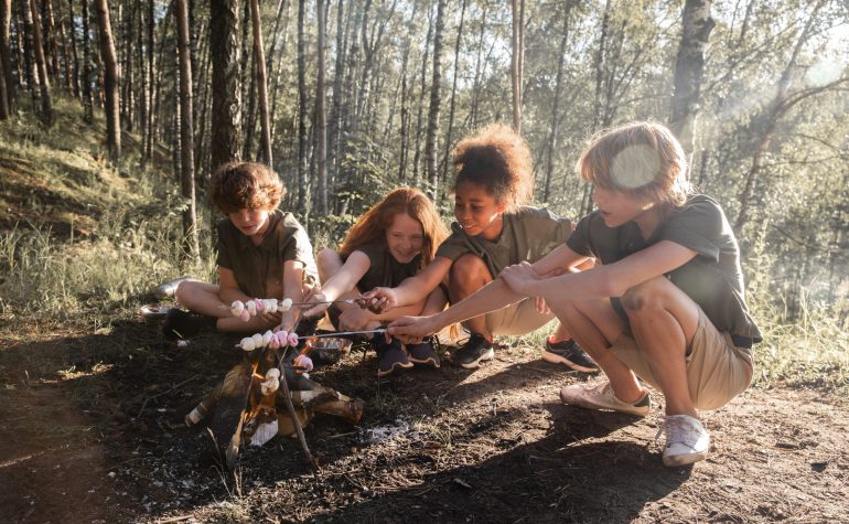 Children enjoying a summer camp covered by camp insurance